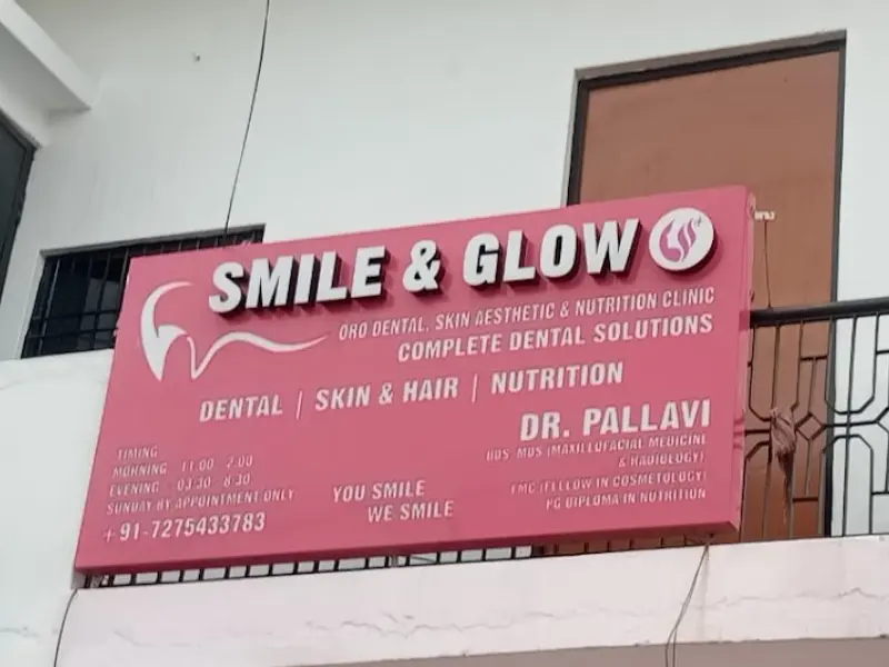 Smile & Glow signboard listing dental, skin & hair and nutrition services